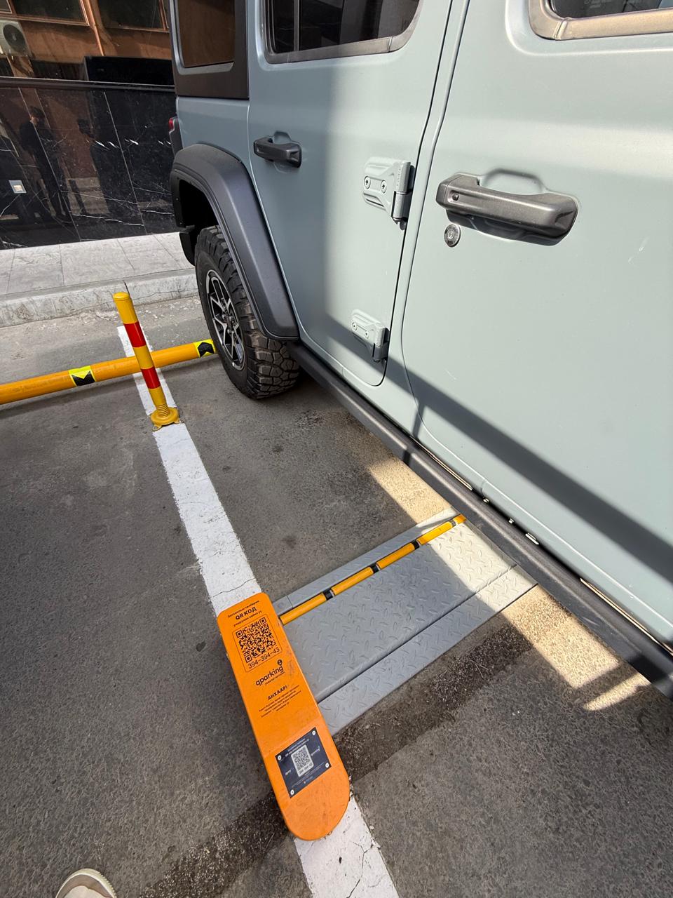 SUV parked with OpenSpot device